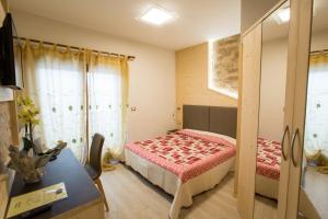 Postel nebo postele na pokoji v ubytování Hotel Franco