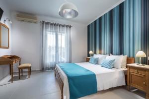 Letto o letti in una camera di Santellini Hotel