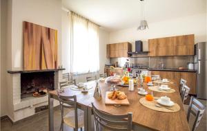 a kitchen with a table with food on it at Nice Home In Viagrande With Wifi in Viagrande