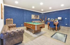 a living room with a pool table and a dining room at Nice Home In Viagrande With Wifi in Viagrande +27 photos