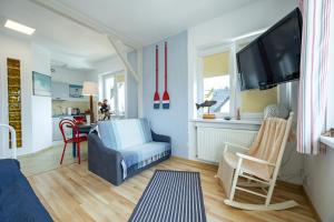 TV a/nebo společenská místnost v ubytování Apartamenty i pokoje blisko morza Gryfa Pomorskiego 54 Międzyzdroje