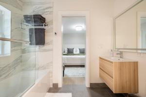 a bathroom with a sink and a mirror at Modern Luxury 3 BR Near Presidio & GG Park in San Francisco