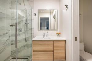 a bathroom with a sink and a shower at Modern Luxury 3 BR Near Presidio & GG Park in San Francisco