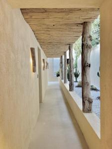 a hallway of a house with a wooden ceiling at Toile Blanche in Saint-Paul-de-Vence