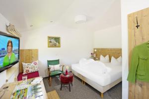 Ένα ή περισσότερα κρεβάτια σε δωμάτιο στο Hotel Maximilian