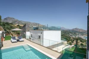 a villa with a swimming pool and a balcony at New seaview villa Venetsianiko with Private Pool & BBQ close to the beach in Sellía +37 photos