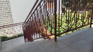 a metal railing on a balcony with a view of a city at Apartmani Dream 3 in Šušanj +8 photos