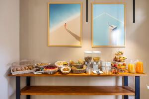 a buffet of food on a table in a room at Locanda Sette Fate SPA e Solarium in Palermo
