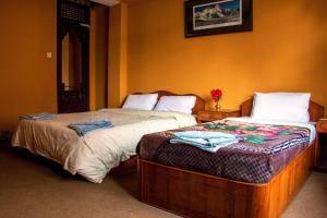 Postel nebo postele na pokoji v ubytování Hotel Metropolitan Kantipur + 31 fotografií