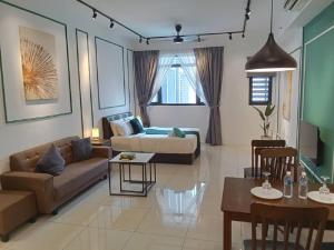 a living room with a couch and a table at Cherry Homes at Chambers Kuala Lumpur in Kuala Lumpur +25 photos