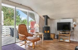 TV a/nebo společenská místnost v ubytování Holiday Home Elvervej Ålbæk Xi