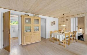 a kitchen and dining room with a table and chairs at Amazing Home In Skjern With Wifi in Skjern