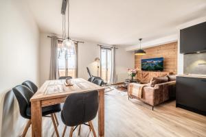 Μια τηλεόραση ή/και κέντρο ψυχαγωγίας στο Apartment Redwood Alpe D'Huez - by EMERALD STAY