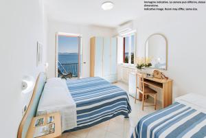 Postel nebo postele na pokoji v ubytování Hotel Bagnitiello