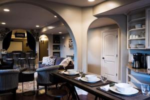 a dining room and living room with a table and chairs at Snuggle Down Inn 1BR In Law Basement Suite in Heber City +33 photos