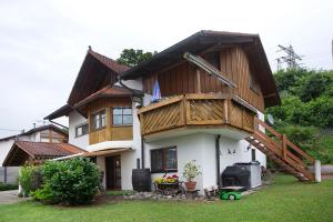 a house with a balcony on top of it at Ferienwohnung Brockmann in Waldshut-Tiengen