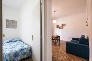 Ένα ή περισσότερα κρεβάτια σε δωμάτιο στο A due passi dal mare