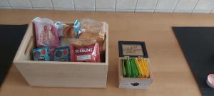 a box of school supplies sitting on a table at La Curta di Vegèss in Pregnana Milanese +10 photos