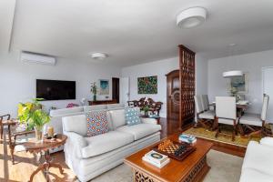 Гостиная зона в Apartamento vista mar e vista pão de açúcar