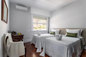 Кровать или кровати в номере Apartamento vista mar e vista pão de açúcar