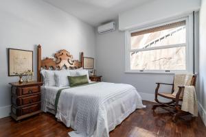 Кровать или кровати в номере Apartamento vista mar e vista pão de açúcar