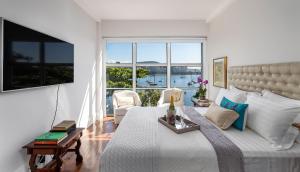 Кровать или кровати в номере Apartamento vista mar e vista pão de açúcar