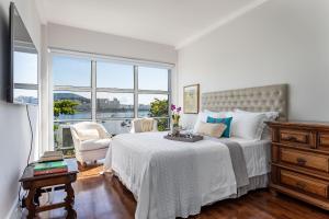 Кровать или кровати в номере Apartamento vista mar e vista pão de açúcar