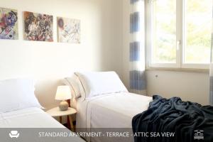 Postel nebo postele na pokoji v ubytování Homey Experience - Design Apartments