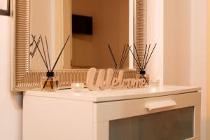a bathroom with a white counter and a mirror at Sunshine Apartment - Salerno in Salerno