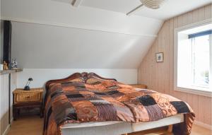 a bedroom with a bed and a window at Gorgeous Home In Saltum With Kitchen in Saltum