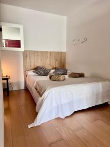 a bedroom with a bed with two stuffed animals on it at Beach LOFT Tabaiba in Tabaiba