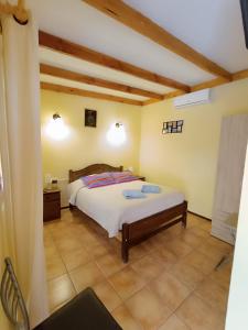 a bedroom with a bed in a room at Hostal Km Zero - El Senor del Lascar in San Pedro de Atacama