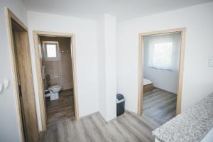 a room with a bathroom with a toilet and a window at Kuća za odmor Suha gora in Vrhovac +35 photos