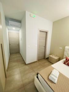 Postel nebo postele na pokoji v ubytování B&B Le Grazie