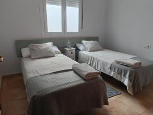 Postel nebo postele na pokoji v ubytování Aracena Centro + 6 fotografií