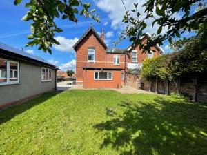 a house with a green yard in front of it at Winwood House in Goole