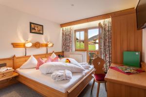 Postel nebo postele na pokoji v ubytování Hotel Garni Hanslerhof " Urlaub am Bauernhof "