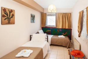 A bed or beds in a room at Villa Karmelina Flat