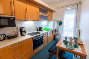 Kuchyňa alebo kuchynka v ubytovaní Armonia Rentals Volos Flat