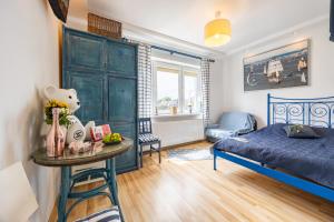 Postel nebo postele na pokoji v ubytování Apartamenty i pokoje blisko morza Gryfa Pomorskiego 54 Międzyzdroje