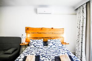 Ένα ή περισσότερα κρεβάτια σε δωμάτιο στο Chaparral Fantastic Apartment +5 φωτογραφίες