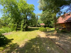 an image of a yard with a house at Zabytkowa Karczma in Jedwabno +16 photos