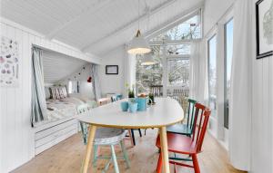a dining room with a table and chairs at 2 Bedroom Nice Home In Odder in Odder