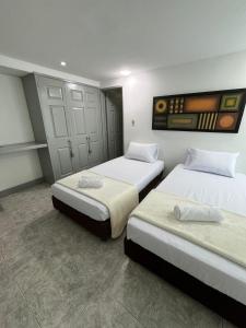 a room with two beds in a room at Hotel Armenia Lions in Armenia +81 photos