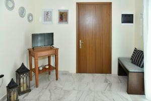 TV a/nebo společenská místnost v ubytování Vasilikis Sea House