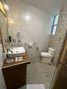 a bathroom with a sink and a toilet at CASA CRISTOBAL Centenario in Cusco