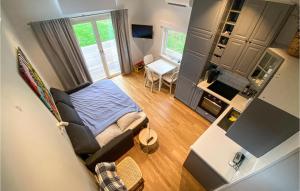 a view of a living room with a bed at 1 Bedroom Stunning Home In Grimsholmen in Grimsholmen