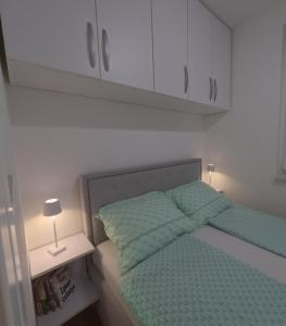 Postel nebo postele na pokoji v ubytování Apartman Stevanovic BN + 11 fotografií