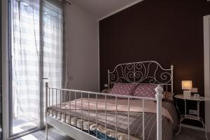 Postel nebo postele na pokoji v ubytování CA' DEL RE SCARTOZZ
