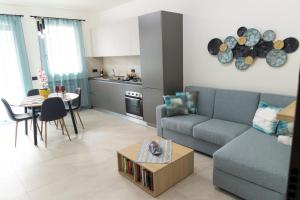 a living room with a couch and a table at Bagheria Home in Bagheria